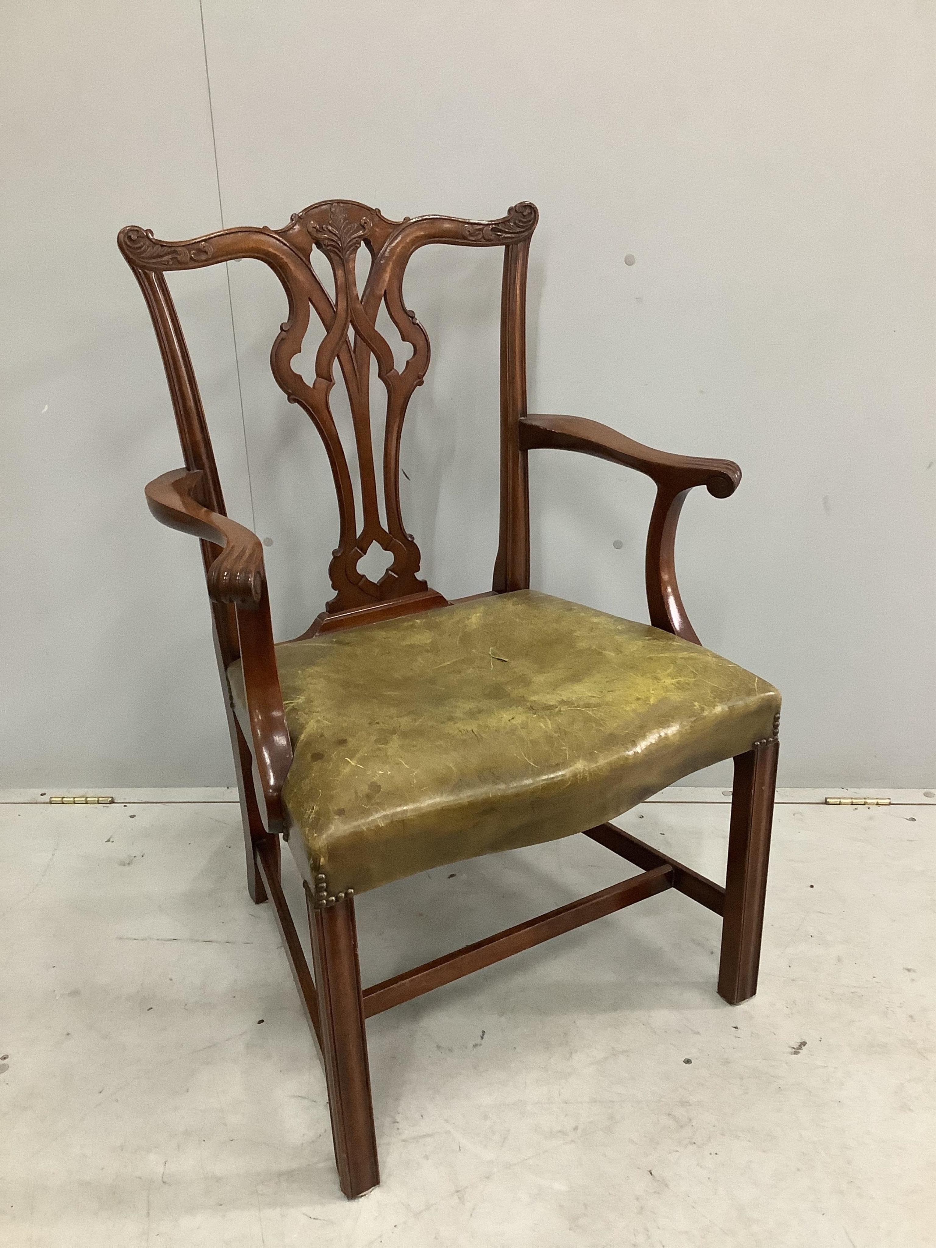 A set of eight reproduction Chippendale style mahogany dining chairs with green leather seats, two with arms. Condition - fair to good